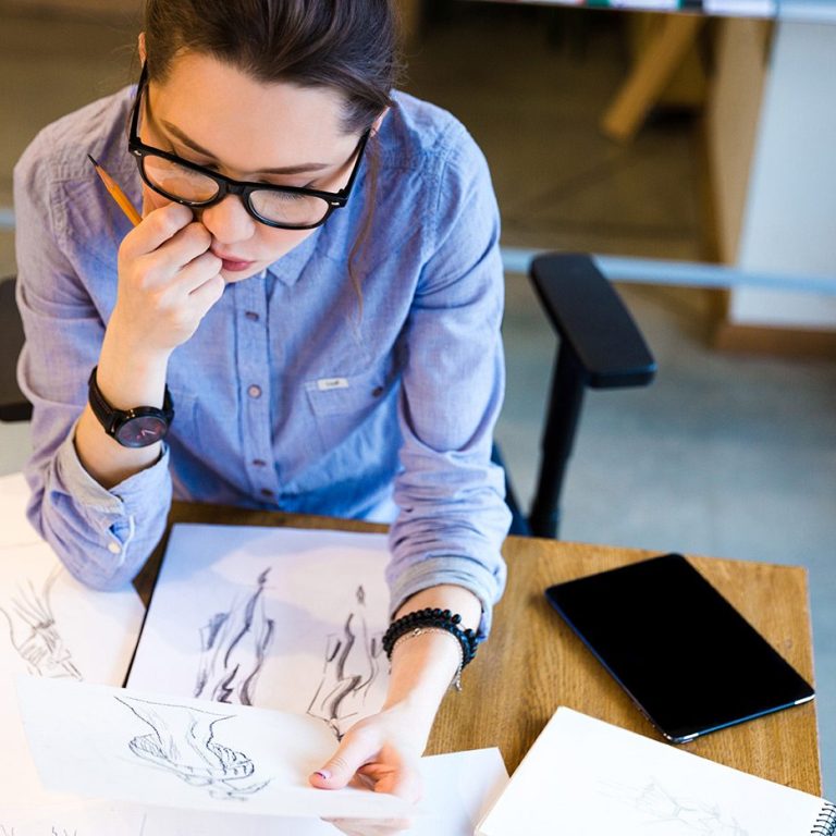 demo-attachment-125-pensive-woman-fashion-designer-sitting-and-PHGZYEM